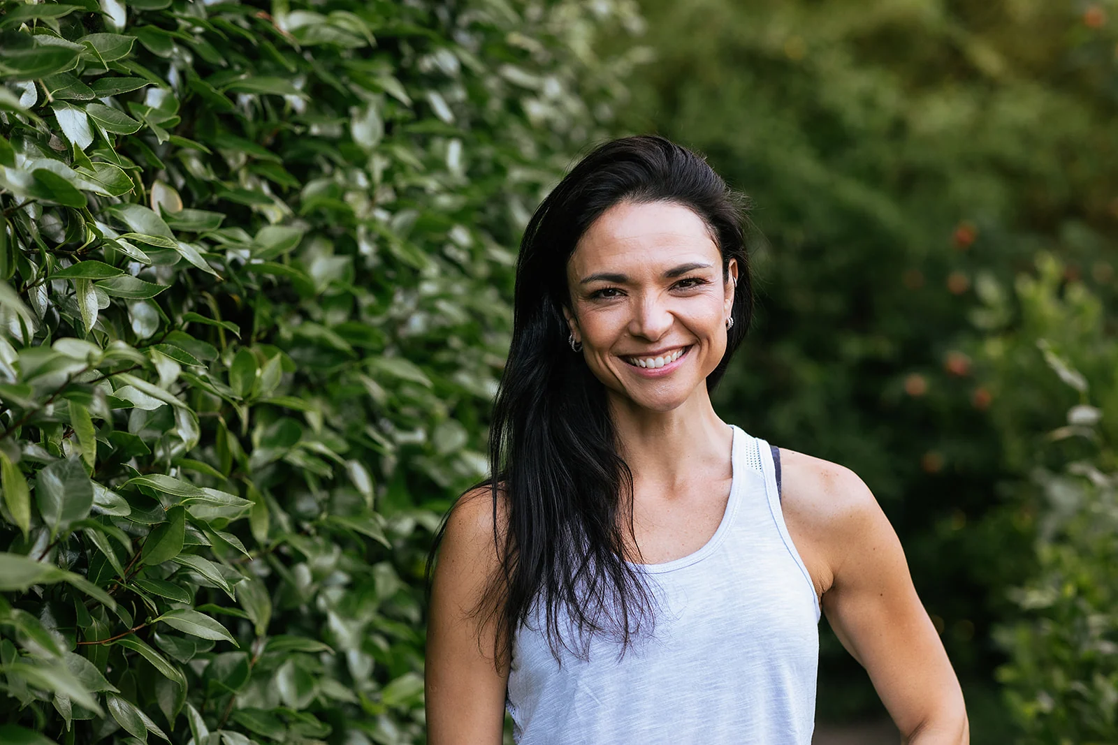 Mayra Hall smiling outdoors